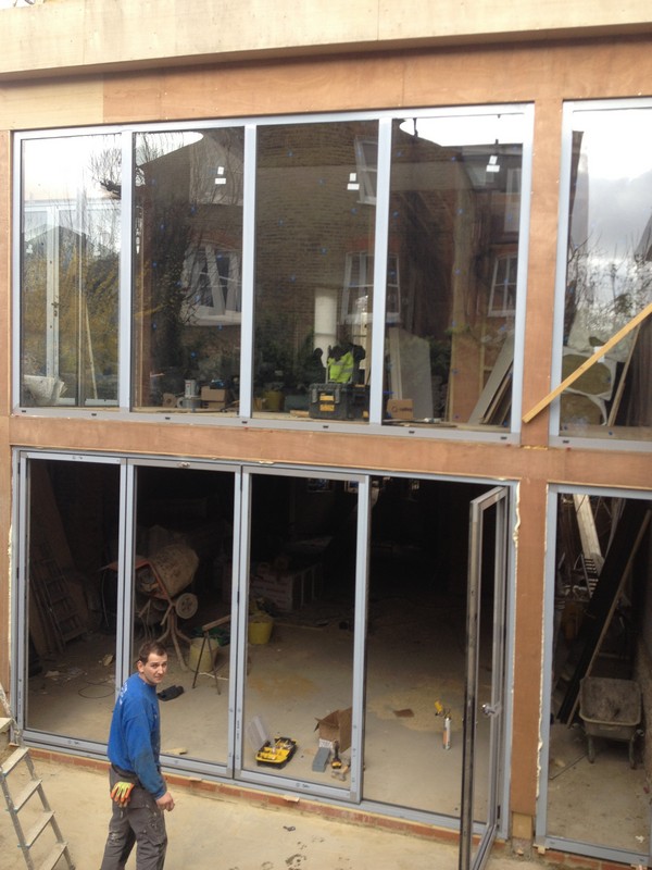 Aluminium bi-fold doors with two-storey glazing in Stratford