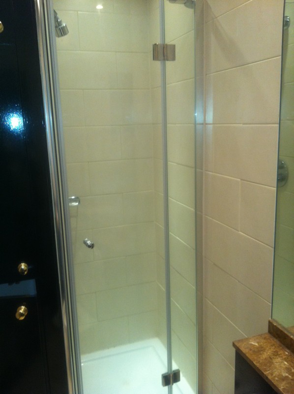 Frameless glass shower enclosure with chrome fittings in Stratford