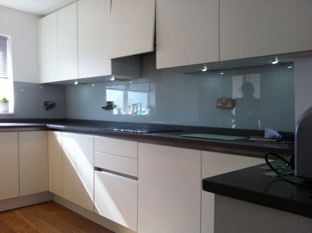 Grey glass kitchen splashback with LED lighting in Stratford