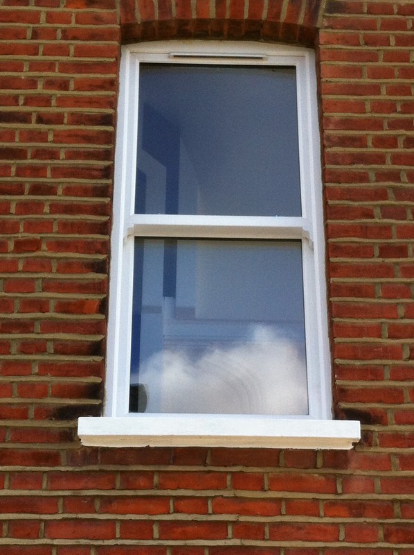uPVC sash window on Victorian red brick house in Stratford